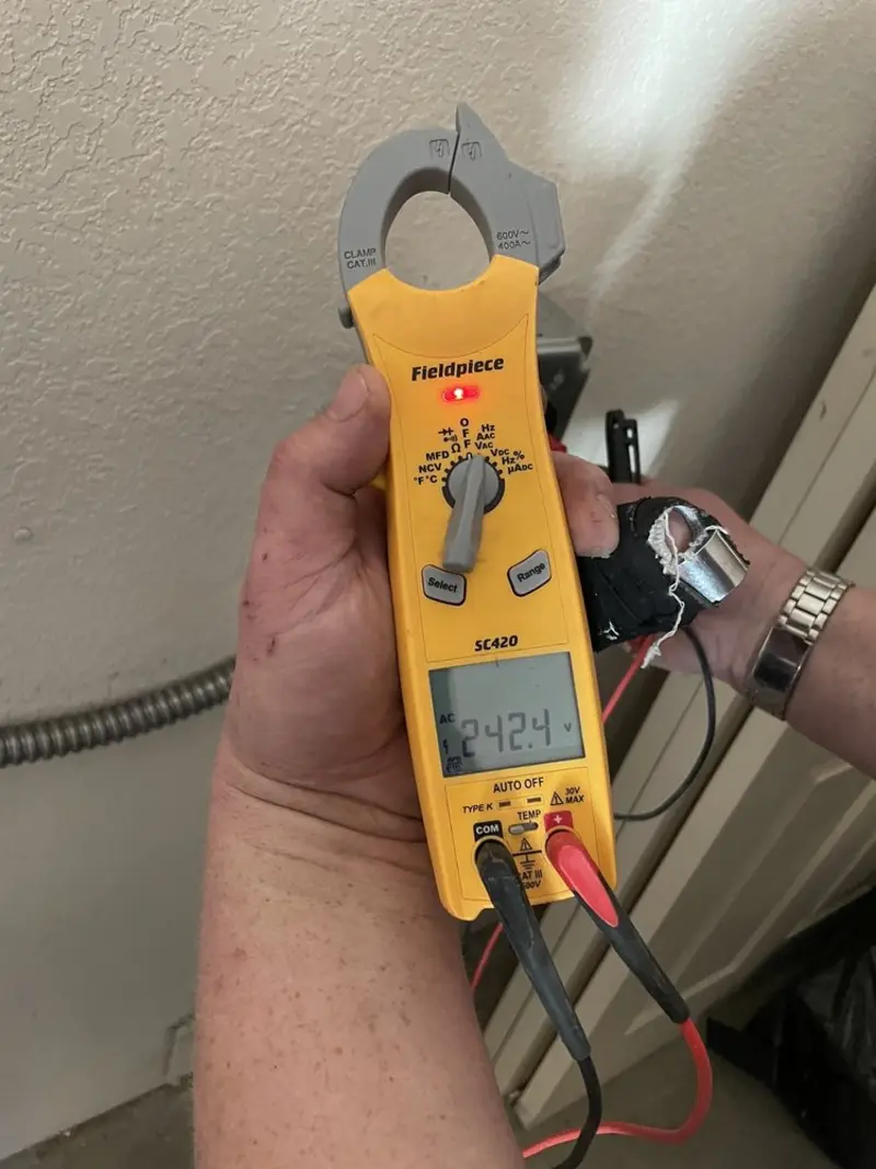 Voltage testing with clamp meter during Aluminum Wiring Replacement in Northbrook